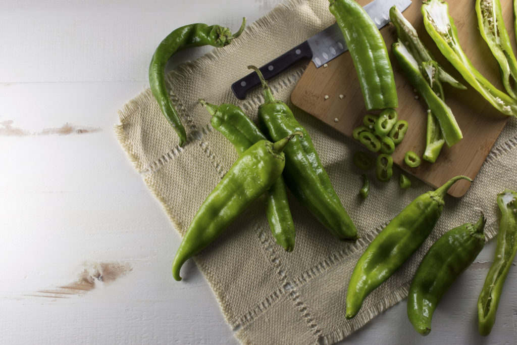 Raw Hatch Chile Peppers on a Cutting Board