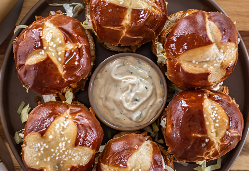 Slow Cooker BBQ Pulled Pork on Pretzel Buns