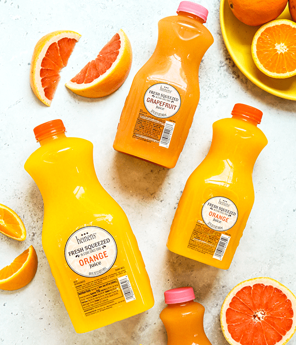 Three Bottles of Heinen's Fan Favorite Fresh Squeezed Juice with Fresh Sliced Citrus