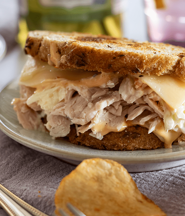 Turkey Rachel Sandwich on a Plate with Kettle Cooked Potato Chips