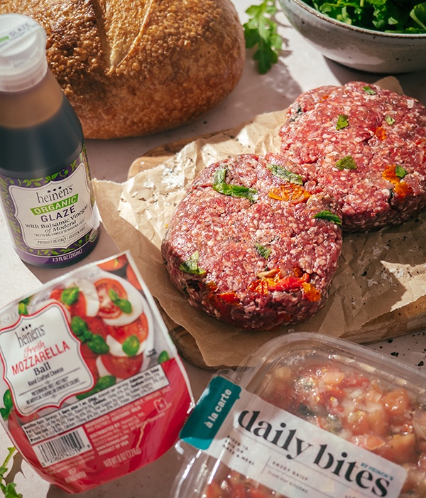 2 Heinen's bruschetta patties placed on parchment paper