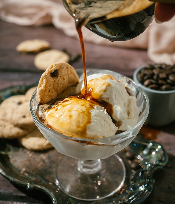 Espresso being poured over scoops of Tillamook ice cream