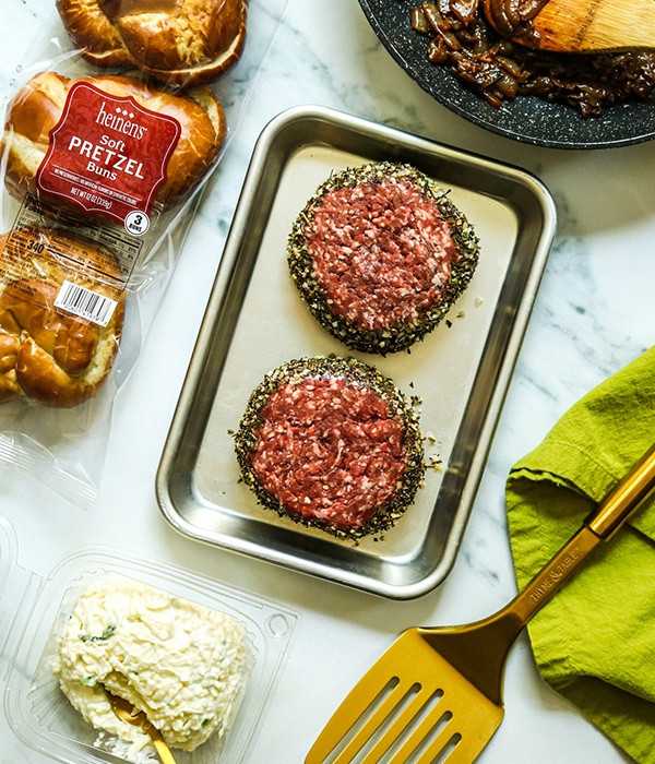 2 Heinen's Gourmet Burger patties on a tray