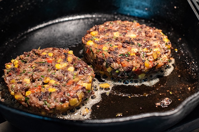 2 Heinen's Gourmet Black Bean Burger Patties in a pan