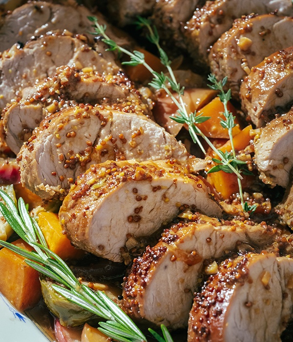 Maple Garlic Marinated Pork Tenderloin with Fall Vegetables on a plate