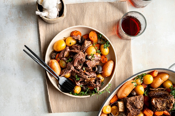 Slow Cooker Beef Short Ribs on a plate with utensils