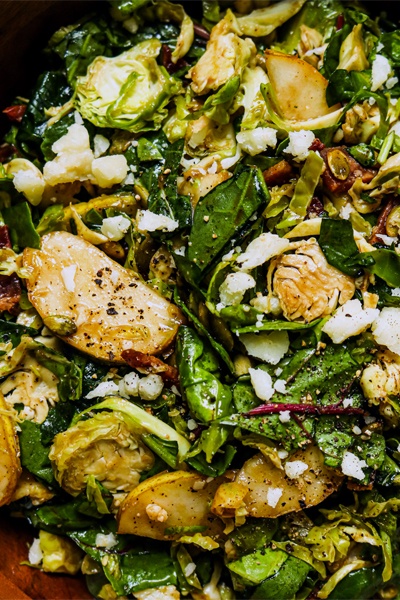 Shaved Brussel Sprouts and Pear Salad in a serving bowl