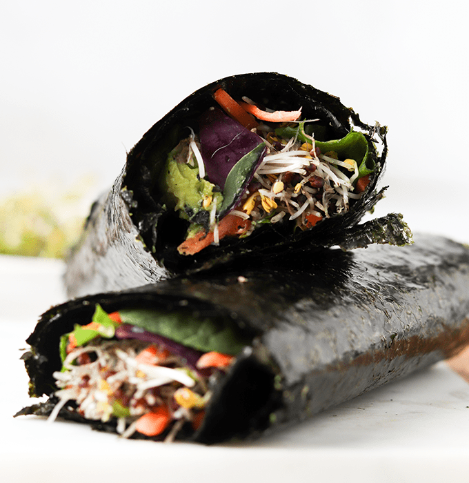 Two Cashew Stuffed Nori Wraps Stacked on Top of Each Other