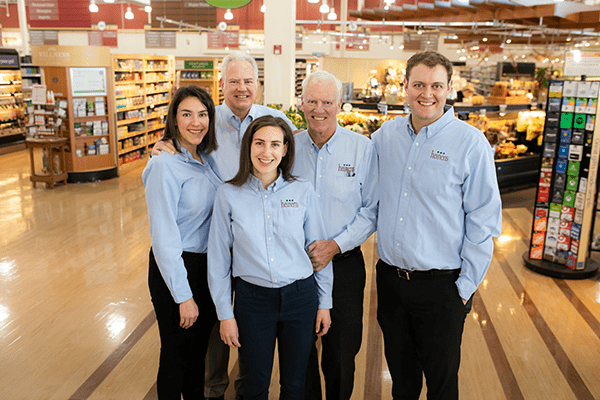 Five Members of the Heinen Family Standing in a Heinen's Store in their Heinen's Uniforms