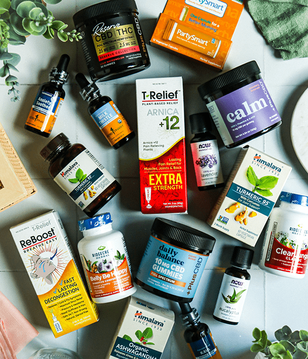 A Top-Down Vertical Image of Homeopathic Wellness Products and Supplements in Packaging