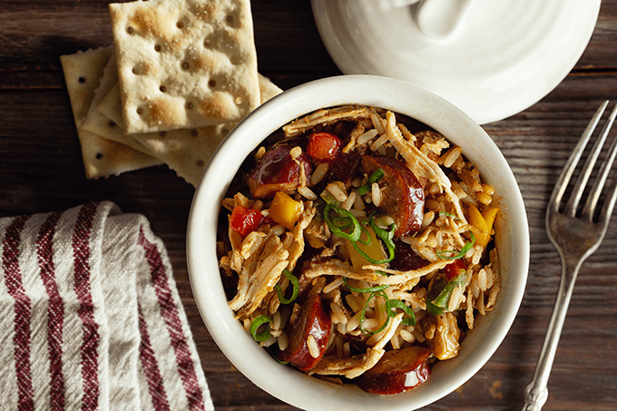 Chicken and Andouille Gumbo in a bowl with a side of saltine crackers. 