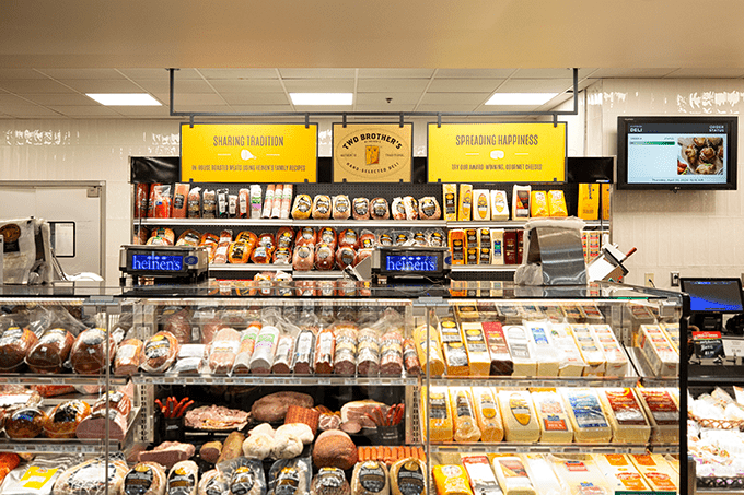 Deli case with meat and cheese.