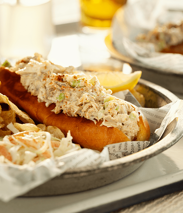 New England Style Crab Roll on a Plate with Coleslaw