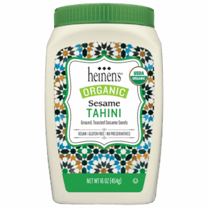 Container of organic sesame tahini made with ground, toasted sesame seeds. The tahini is vegan, and gluten free with no preservatives.