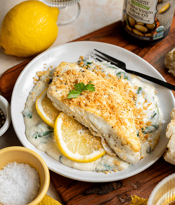 Easy Halibut Florentine on a Plate with Lemon Slices
