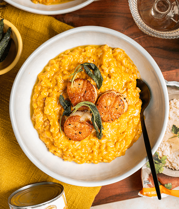 A Top-Down Image of Pumpkin Risotto with Seared Scallops
