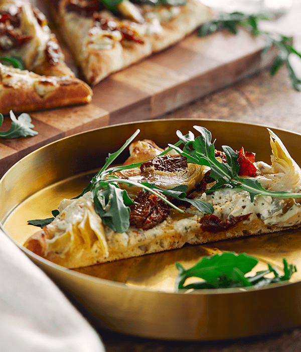 A Tuscan Flatbread Slice on a Gold Plate
