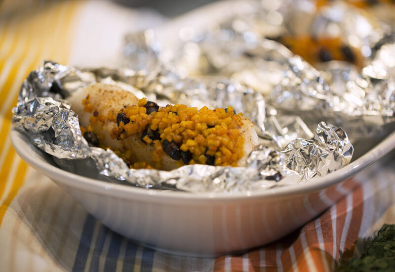 Sea Bass en Papillote with Black Beans, Zucchini and Chipotle Butter